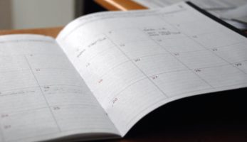 An open calendar on a desk.