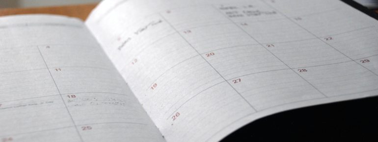 An open calendar on a desk.