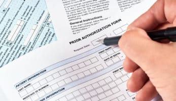 image: Person filling out a "Prior Authorization Form"