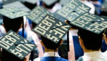 image: Graduation class with the amount of debt they are graduating with on the top of their caps