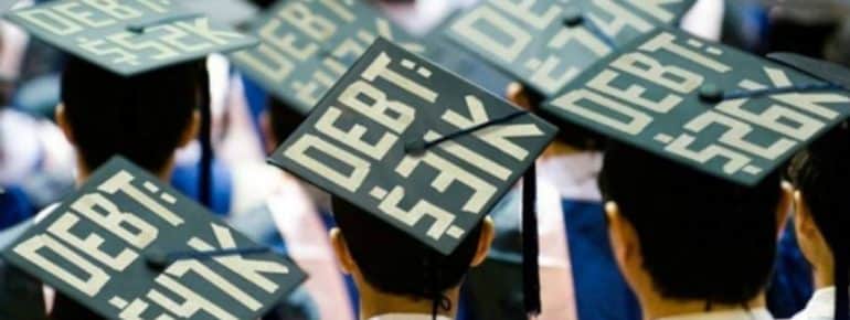 image: Graduation class with the amount of debt they are graduating with on the top of their caps