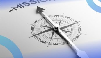 image: a compass pointing towards the word "Mission"