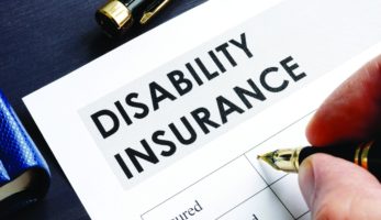 image: Person filling out Disability Insurance form