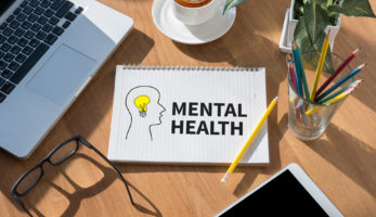 image: Notebook with the words "Mental Health"